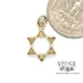 Star of David 14ky gold pendant back next to quarter for scale