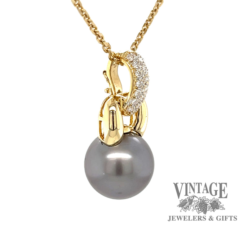 18 karat yellow gold Tahitian pearl enhancer pendant with pave' set diamonds, angled view