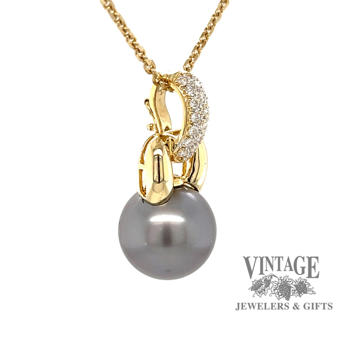 18 karat yellow gold Tahitian pearl enhancer pendant with pave' set diamonds, angled view