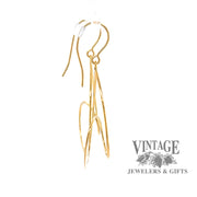 14k spiral drop earrings from side.