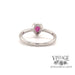 14 karat white gold pear shape ruby ring with diamond halo, rear view 