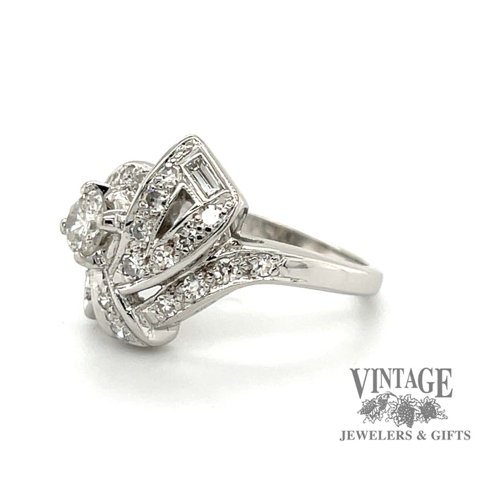 Vintage Art Deco 14 karat white gold diamond pave bow motif ring, angled side view