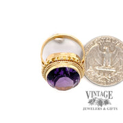 Oval bezel set amethyst 18ky gold ring quarter for scale