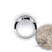 14 karat white gold Blue sapphire and diamond band ring, shown with quarter for size reference
