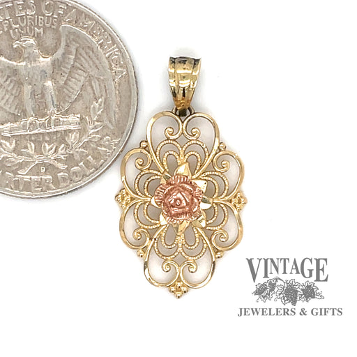 14 karat yellow gold filigree and rose pendant, shown with quarter for size reference