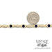 10 karat yellow gold lab grown sapphire 7" bracelet, shown with quarter for size reference