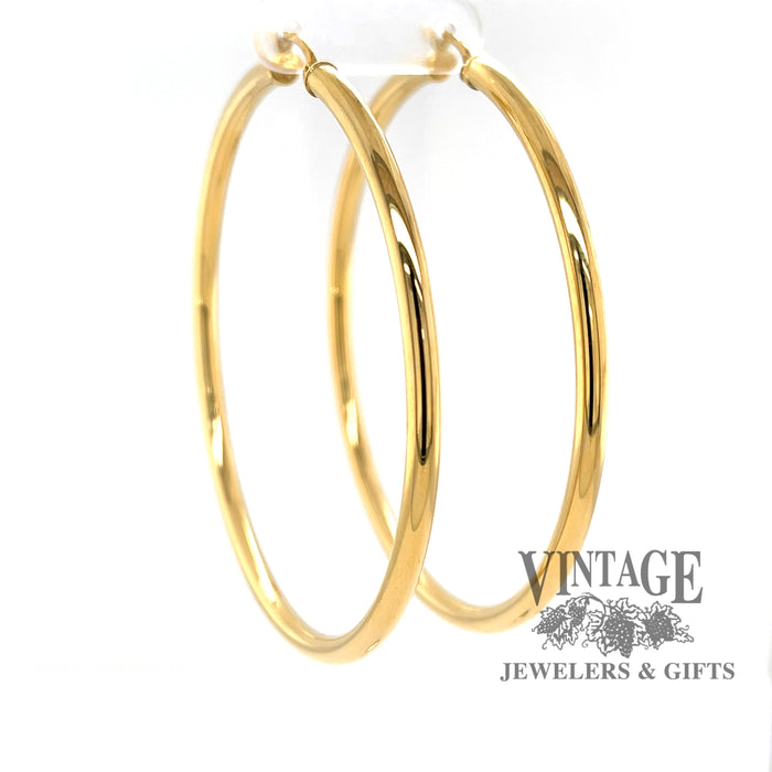 Extra large 60 mm 14k hoop earrings from side angle