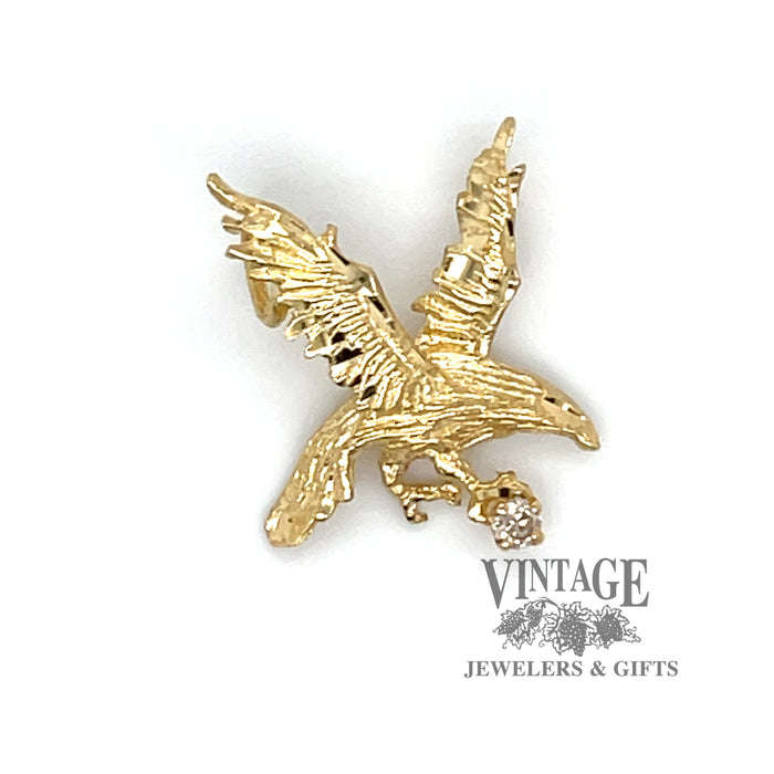 Eagle charm with small diamond in 14 ky