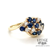 14 karat yellow gold estate sapphire and diamond cluster ring, angled view
