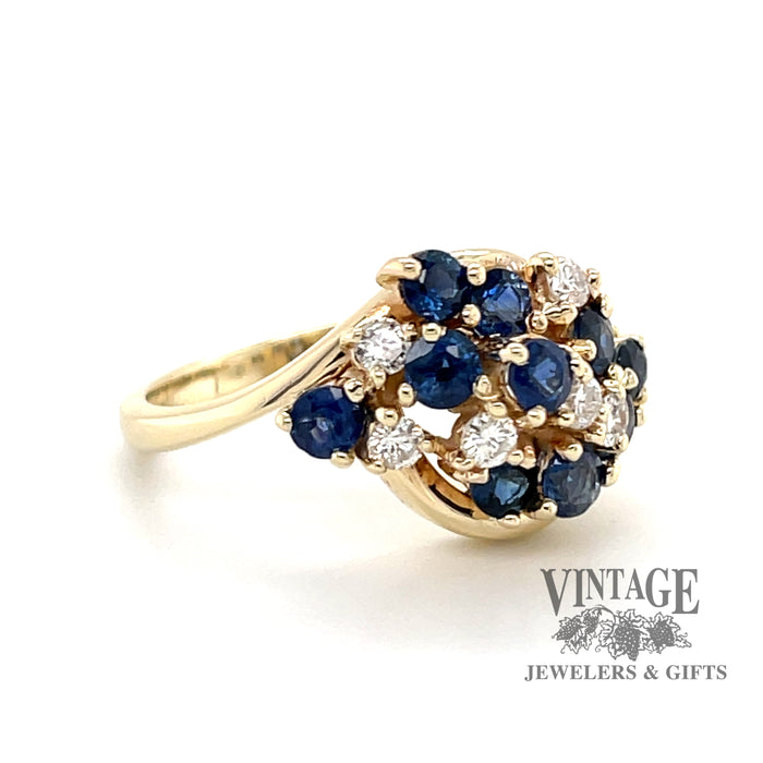 14 karat yellow gold estate sapphire and diamond cluster ring, angled view