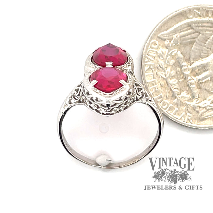 14 karat white gold 2.8 carat total weight ruby vintage filigree ring, end view through finger, with quarter for size reference