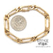 18 karat yellow gold elongated link 7mm wide bracelet, next to quarter for scale