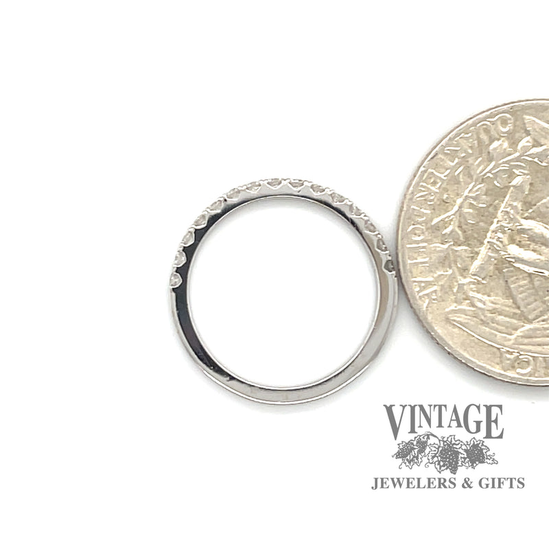 14 karat white gold French set .19ctw VS diamond band ring, shown with quarter for size reference