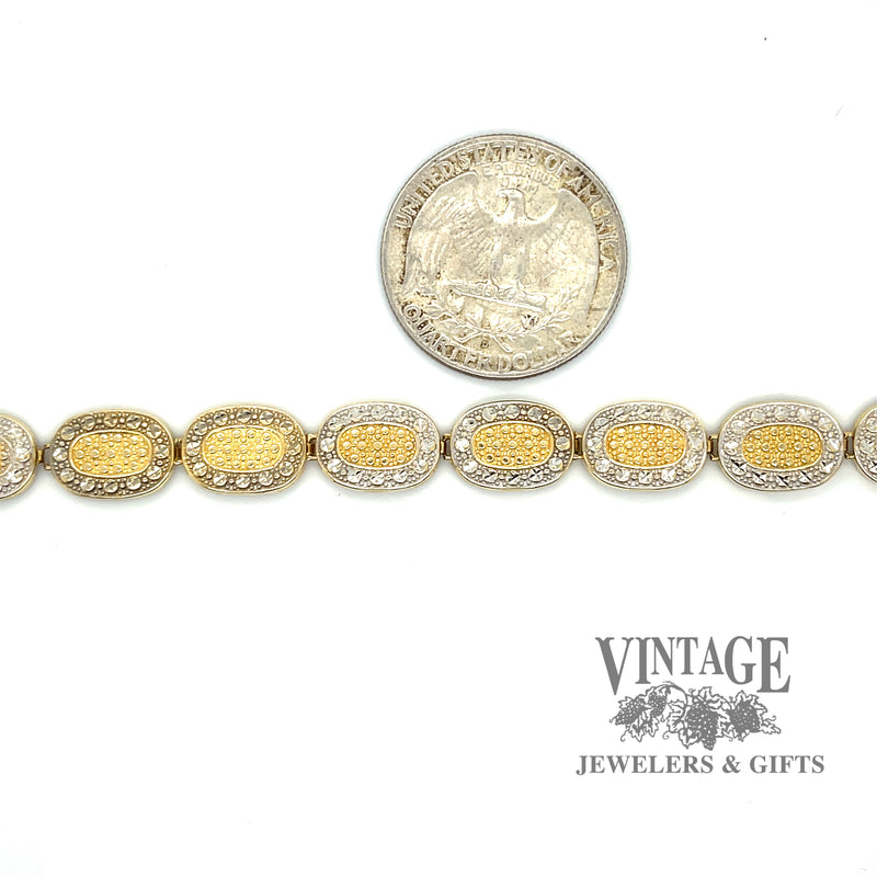 Two tone oval link embossed 14k gold 7.5" bracelet with quarter for scale