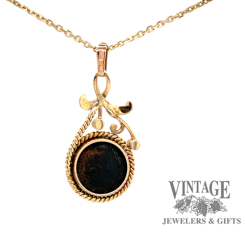 back view of 14 karat yellow gold dark green cat's eye tourmaline pendant