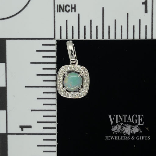 14 karat white gold .33ct Opal and diamond halo pendant