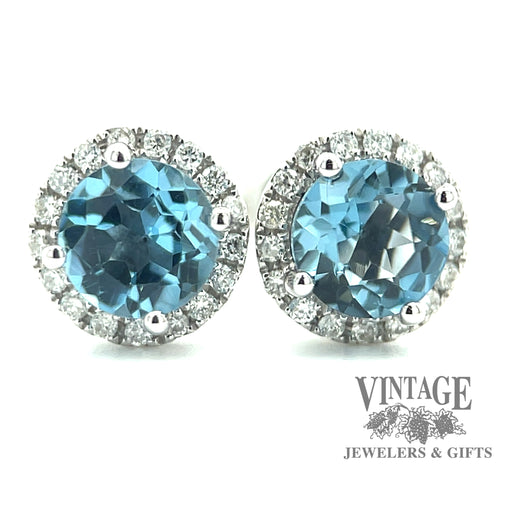 Blue topaz and diamond 14kw gold halo stud earrings close up