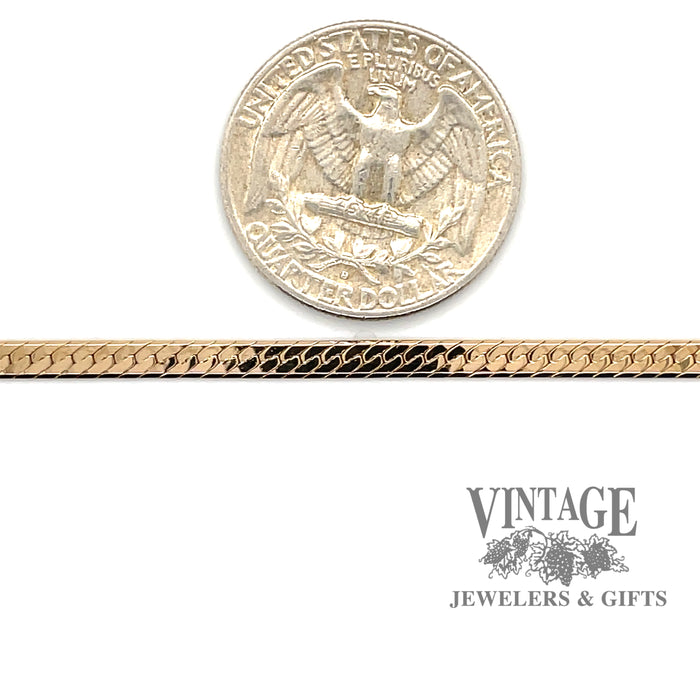 14 karat yellow gold 16” Herringbone chain, shown with quarter for size reference