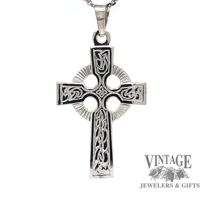 14k white gold Celtic cross pendant. The cross is not black.  That is reflection from the camera only.
