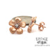 14 karat rose gold floral diamond earrings, shown with quarter for size reference