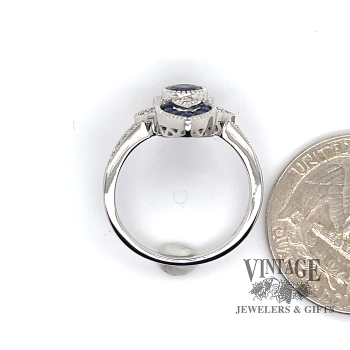 14 karat white gold .63 carat total weight natural blue sapphire and diamond ring, side view through ring, shown with quarter for size reference