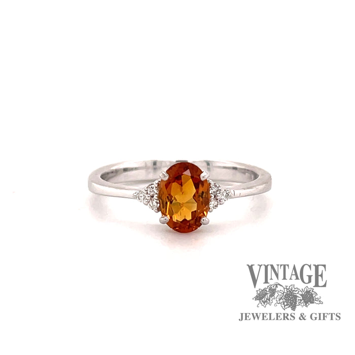 14 karat white gold oval citrine ring with diamond clusters