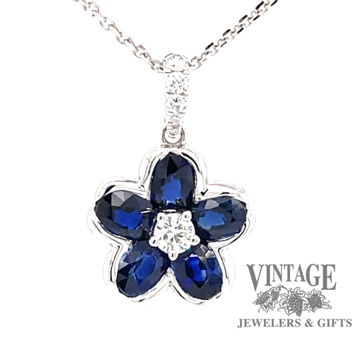 18 karat white gold  blue sapphire and diamond flower pendant, front view
