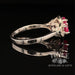 18 karat white gold 3 stone ruby and diamond halo ring, side view