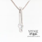 14 karat white gold bar set .25 CT diamond solitaire pendant, angled side/front view.