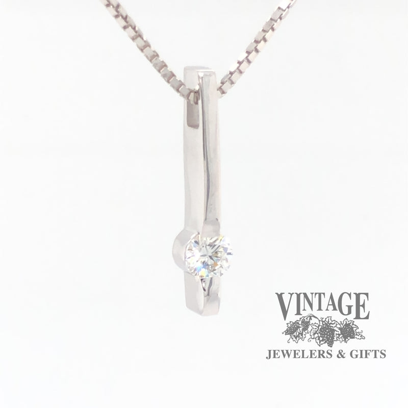 14 karat white gold bar set .25 CT diamond solitaire pendant, angled side/front view.