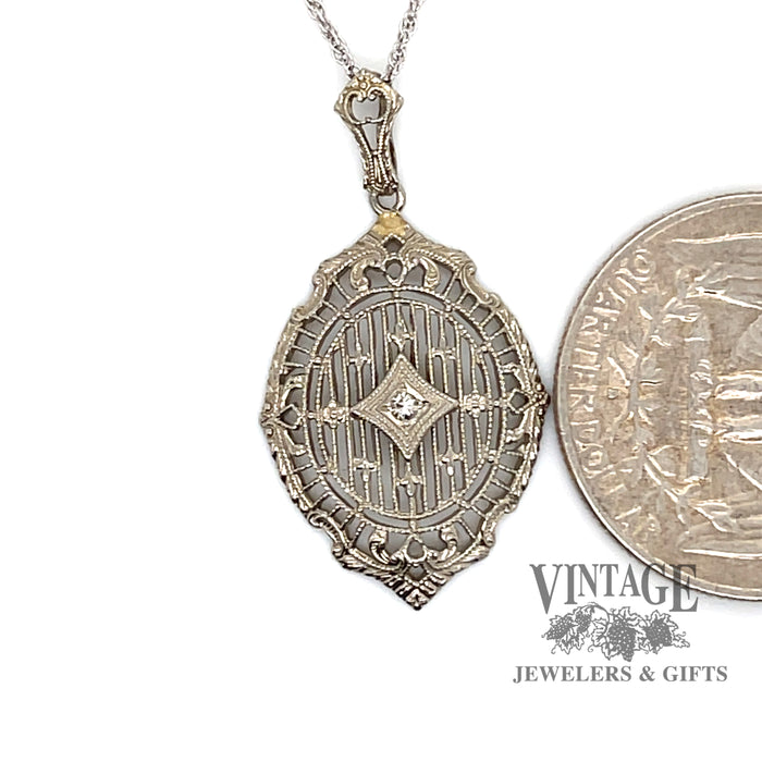 Filigree .02ct diamond pendant in 14kw gold