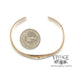 14 karat yellow gold forged Anticlastic cuff bangle bracelet, shown with quarter for size reference