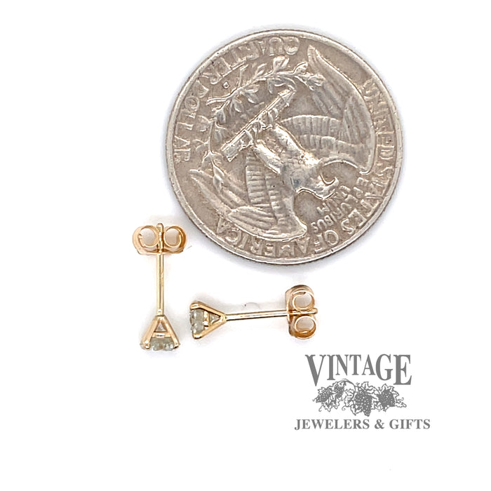14 karat yellow gold .50 ctw lab grown martini style diamond stud earrings, shown with quarter for size reference