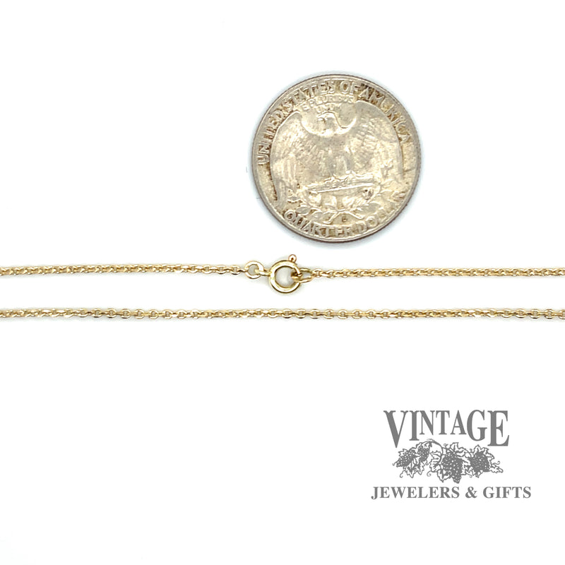 14 karat yellow gold round open link diamond cut cable chain shown with quarter for size reference