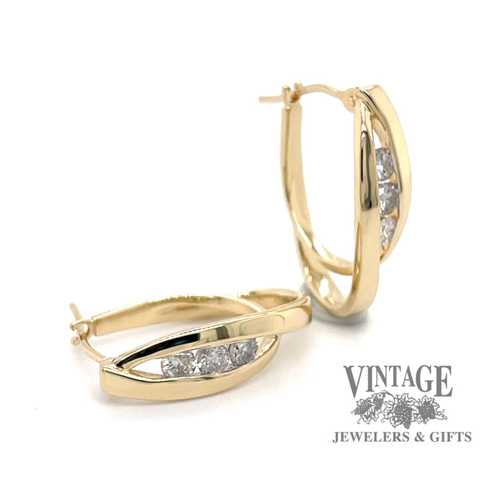 14 karat yellow gold estate diamond hoops with a crossed double oval loop design, front & angled
