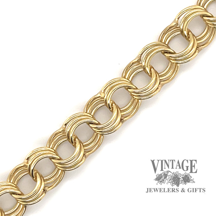 Yellow gold triple link charm bracelet