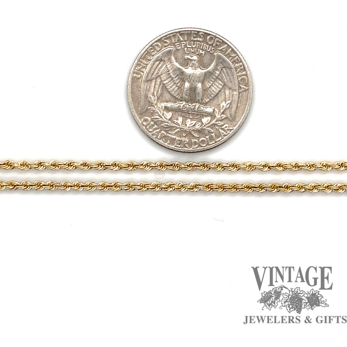 14 karat yellow gold 18" solid 2mm rope chain, shown with quarter for size reference
