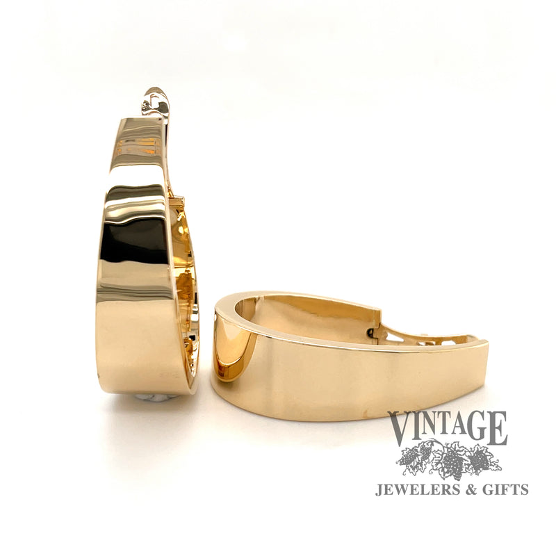 Large flat tapered 14ky gold hoop earrings, front
