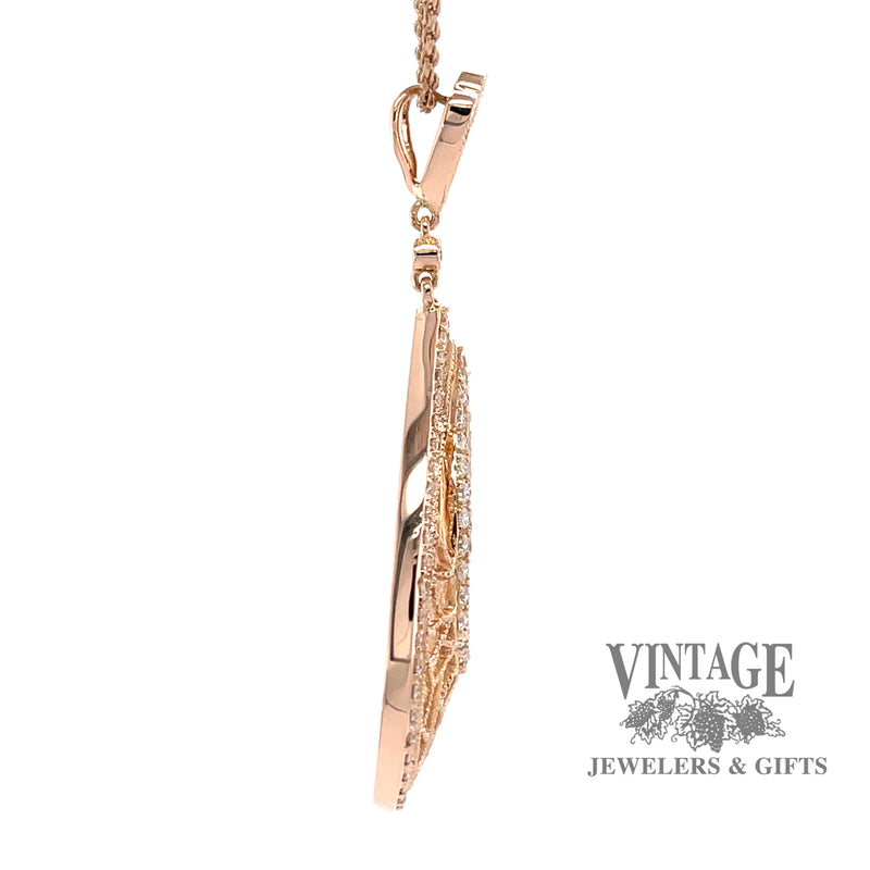 Pear shaped 14kr gold diamond pendant side