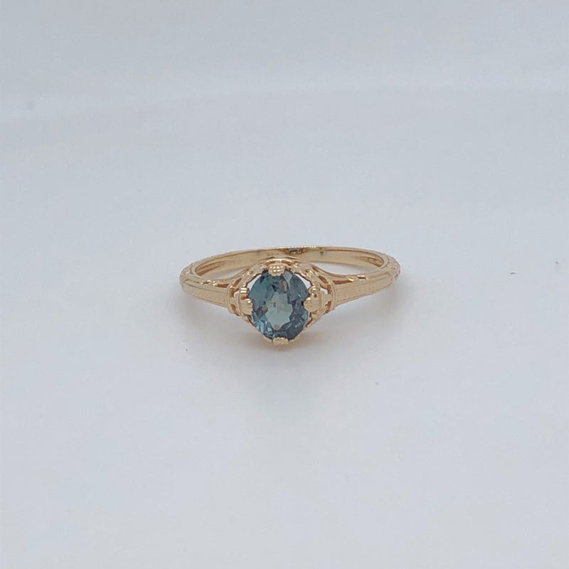 Top view of 14 karat yellow gold natural alexandrite ring.