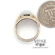 14 karat yellow and white gold .22ctw 3-diamond tapered ring, shown with quarter for size reference