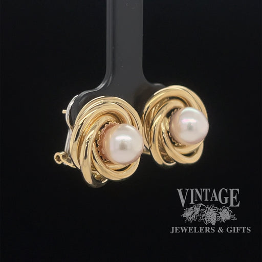 18 karat yellow gold 8mm Pearl swirl earrings, angled view