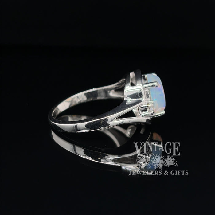 Crystal opal ring in white gold with diamonds side