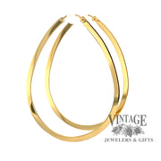 Large 14K gold flat teardrop shaped hoops from side