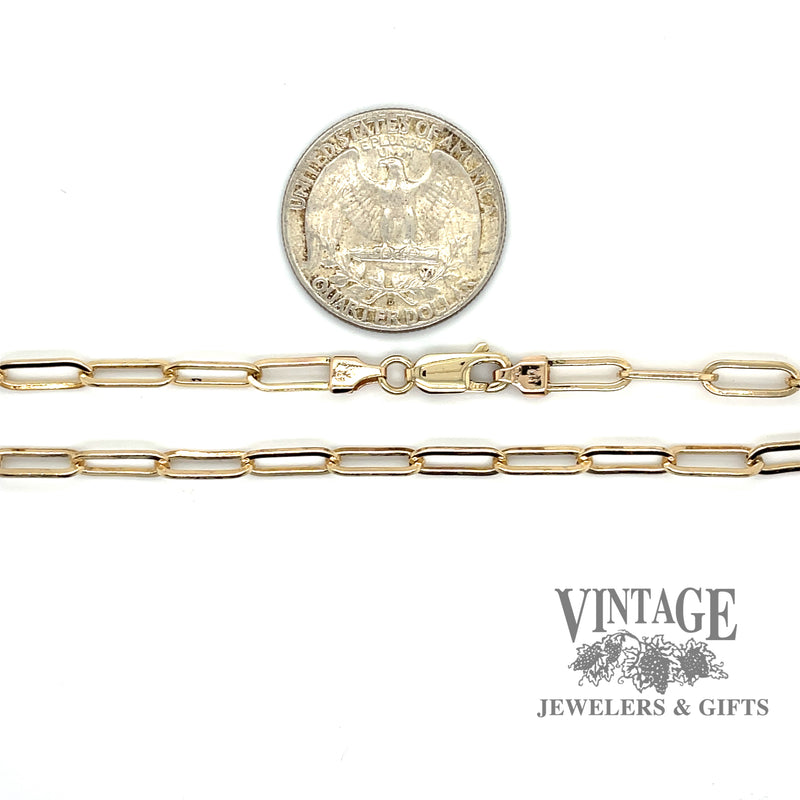 22” Paperclip 14ky gold solid chain quarter for scale