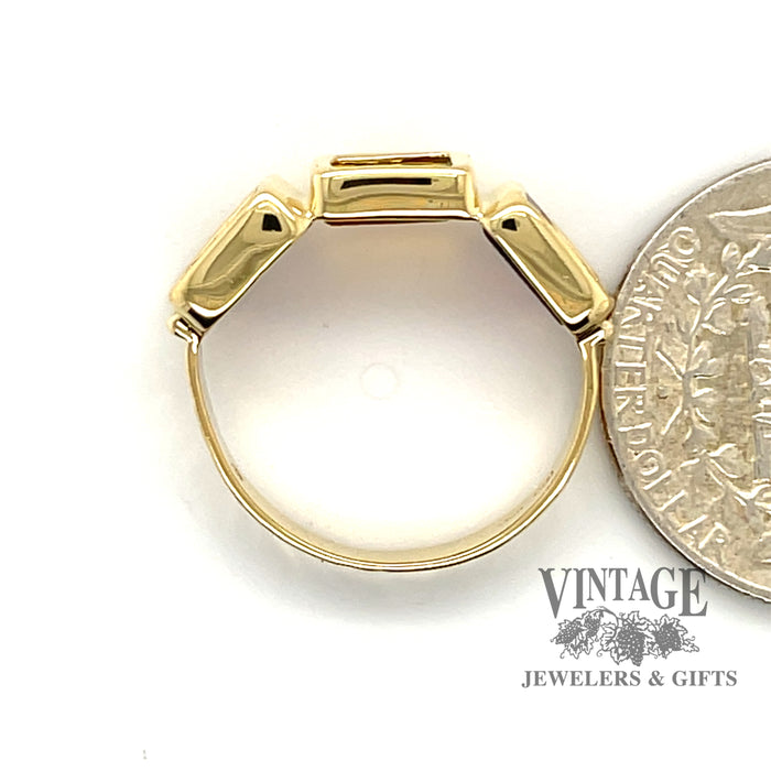 18 karat yellow gold carved cherub Intaglio three stone ring, side view through finger, shown with quarter for size reference