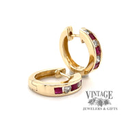14 karat yellow gold Ruby and diamond huggie hoop earrings, angled view