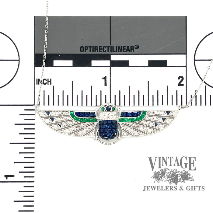 18 karat white gold Egyptian revival sapphire, emerald and diamond scarab necklace with measurements.