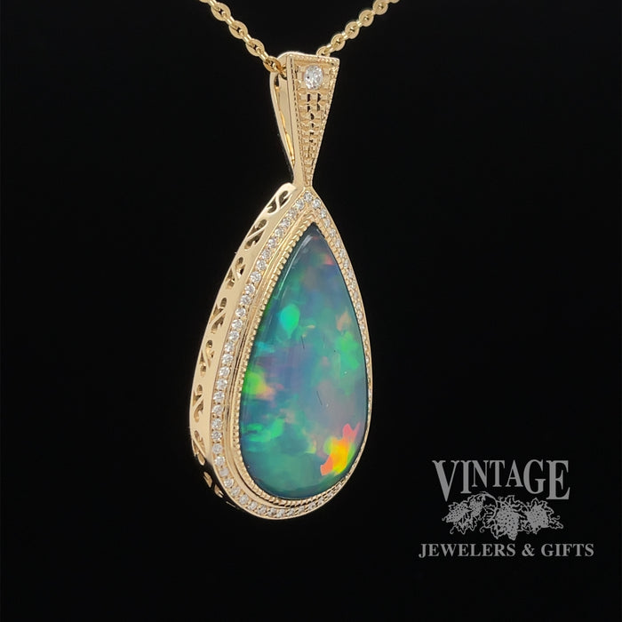 14 karat yellow gold 9.63ct Pear shape opal with diamonds pendant, angled view