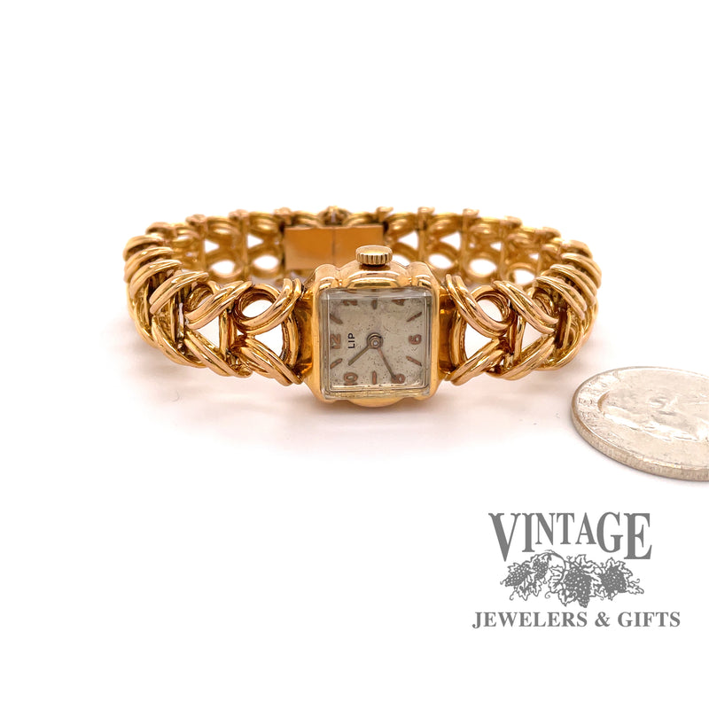 Rare French "Lip" (brand) 18 karat gold mechanical watch, shown with  quarter for size reference